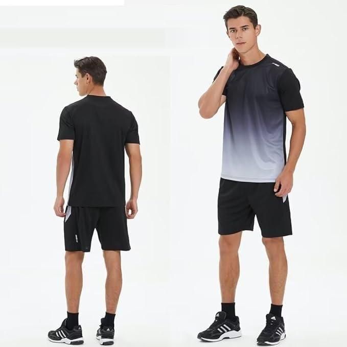 Man wearing a black and gray gradient T-shirt with black shorts and sneakers casual summer outfit for men