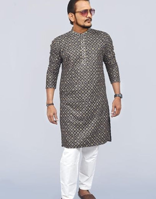Man wearing a Kashmiri embroidered kurta for men with intricate patterns paired with white pants